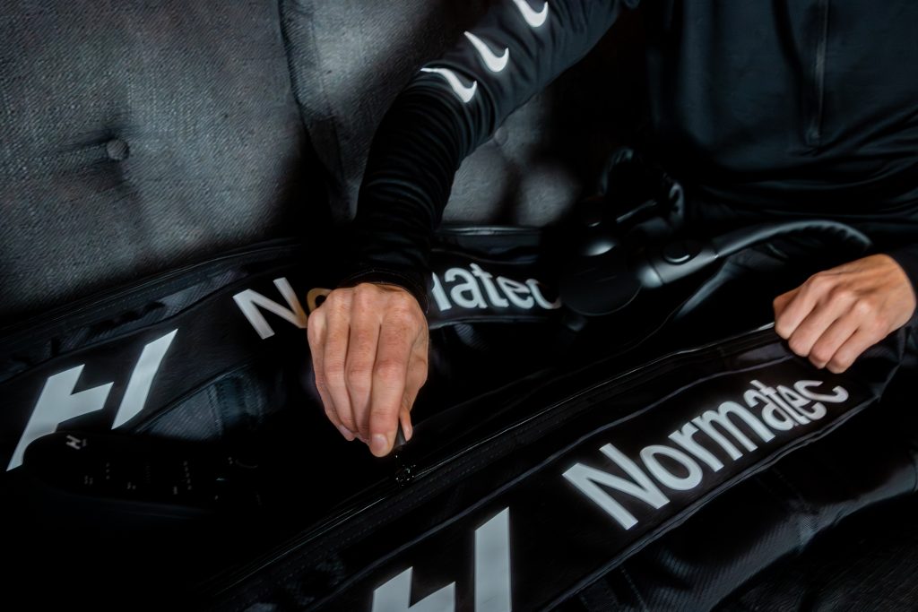 zipping up normatec recovery boots